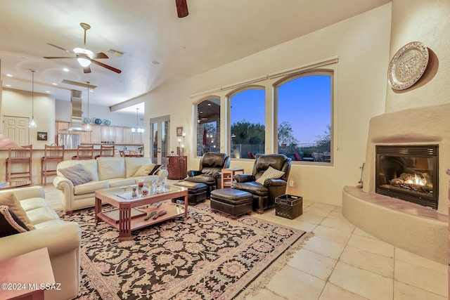 living room with light tile patterned flooring and ceiling fan