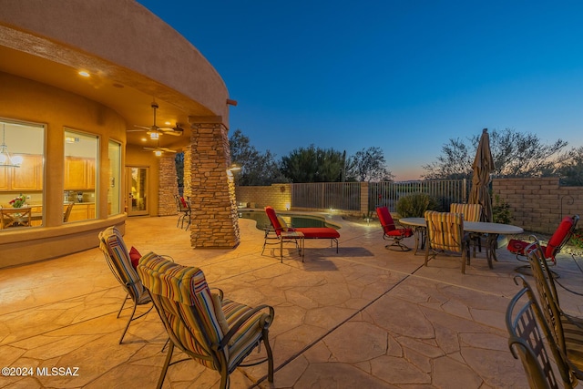 patio terrace at dusk with ceiling fan