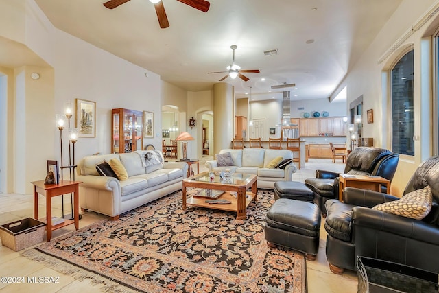 tiled living room featuring ceiling fan