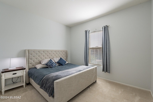 bedroom with light carpet