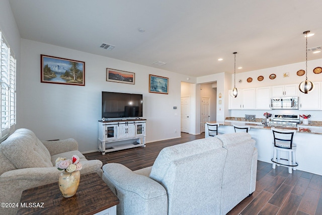 living room featuring plenty of natural light