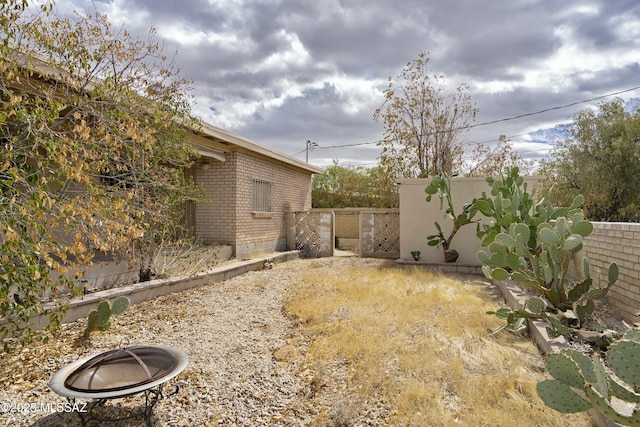 view of yard featuring a gate and fence