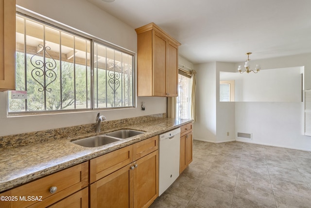 kitchen featuring visible vents, a sink, light tile patterned flooring, baseboards, and dishwasher