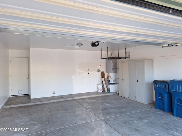 garage featuring gas water heater and a garage door opener