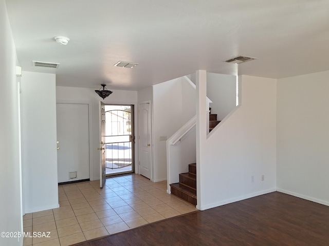 entryway with light tile patterned floors