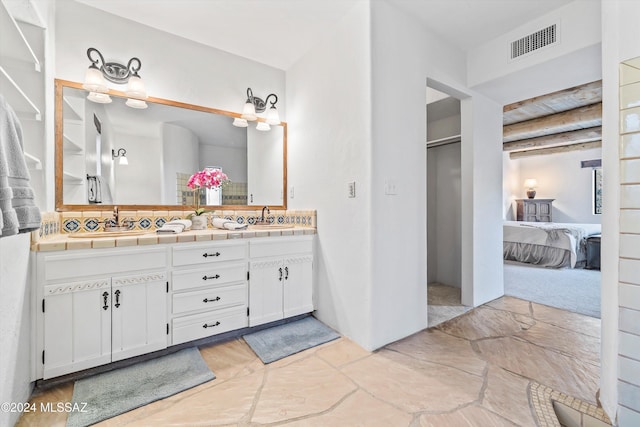 bathroom with vanity and backsplash