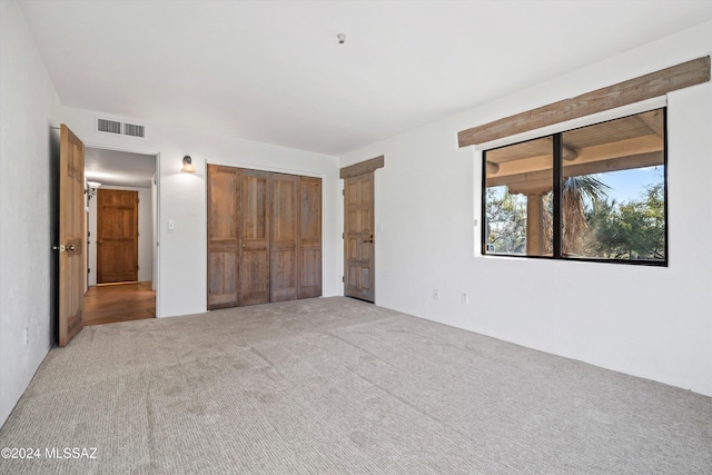 unfurnished bedroom with carpet