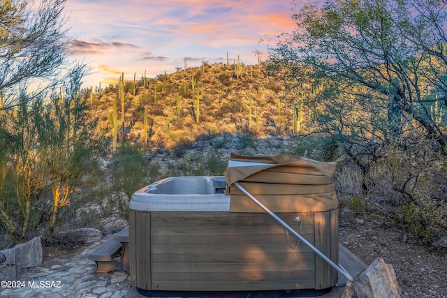 exterior space featuring a hot tub