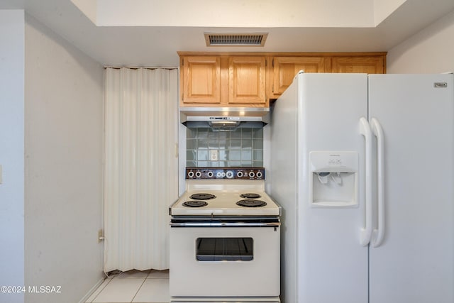 kitchen with under cabinet range hood, white appliances, visible vents, backsplash, and light brown cabinetry