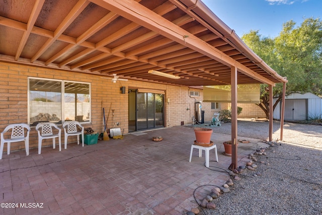 view of patio with a storage shed and an outdoor structure