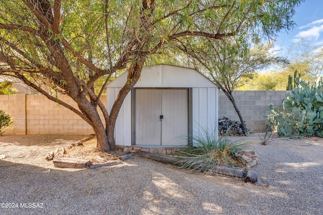 view of shed featuring a fenced backyard