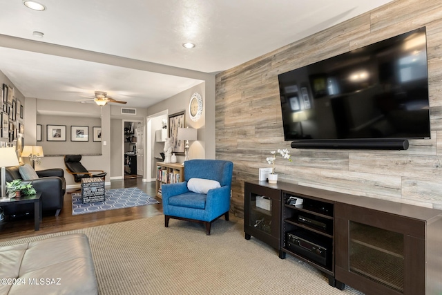 living room with ceiling fan and light hardwood / wood-style floors