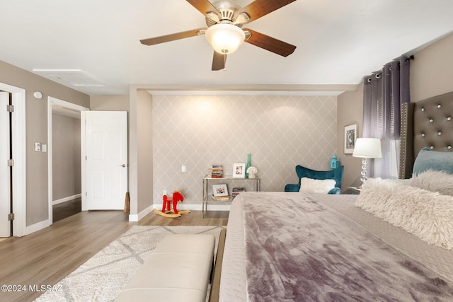 bedroom featuring ceiling fan and light hardwood / wood-style flooring