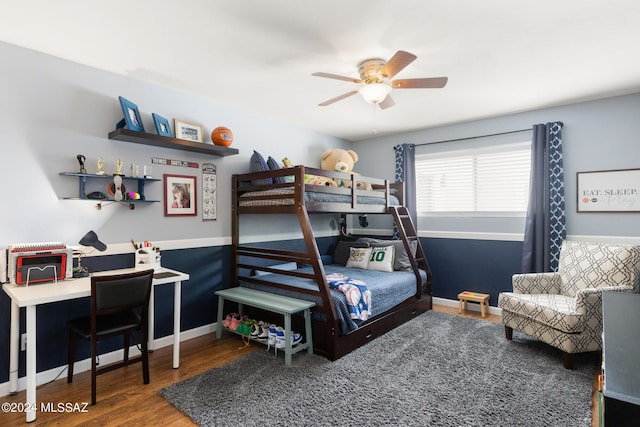 bedroom with ceiling fan and wood-type flooring