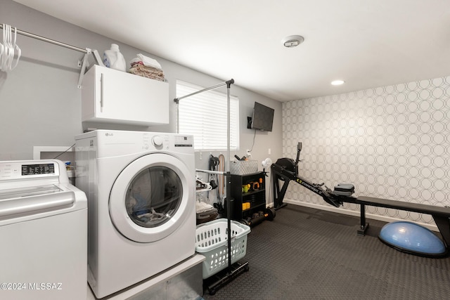 laundry area with independent washer and dryer