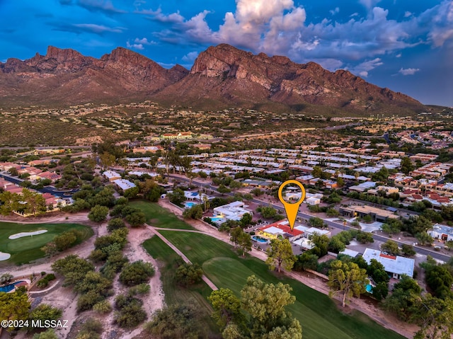 birds eye view of property with a mountain view