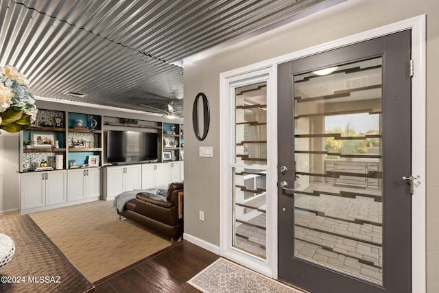 entryway with ceiling fan and dark hardwood / wood-style floors