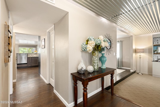 corridor featuring dark hardwood / wood-style flooring