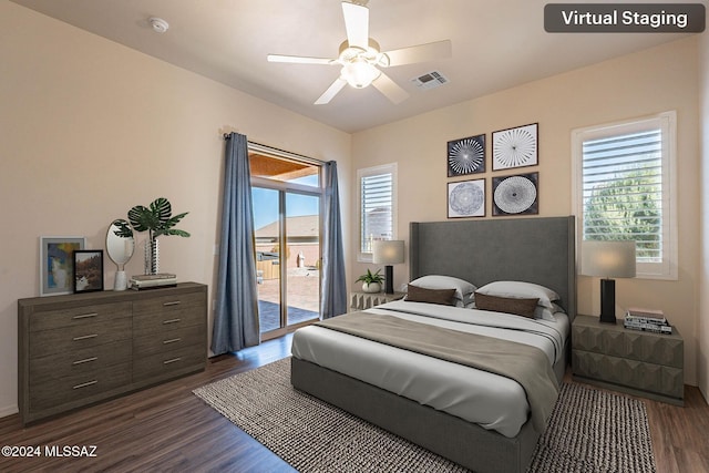 bedroom featuring access to outside, multiple windows, ceiling fan, and dark hardwood / wood-style flooring