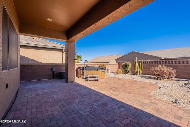 view of patio / terrace featuring a hot tub