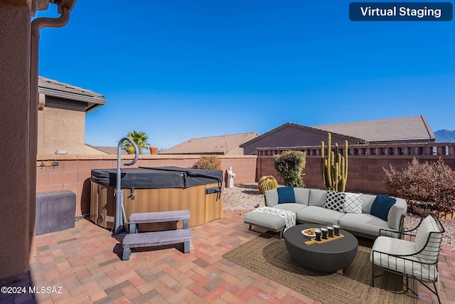 view of patio featuring an outdoor hangout area and a hot tub