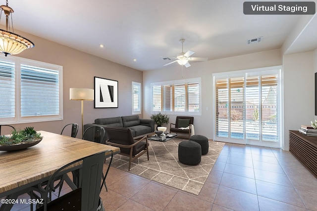 tiled living room with ceiling fan