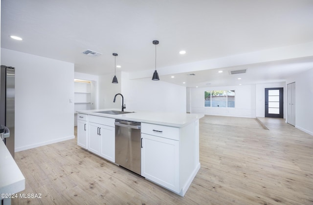 kitchen featuring light wood-type flooring, stainless steel dishwasher, a kitchen island with sink, sink, and white cabinets