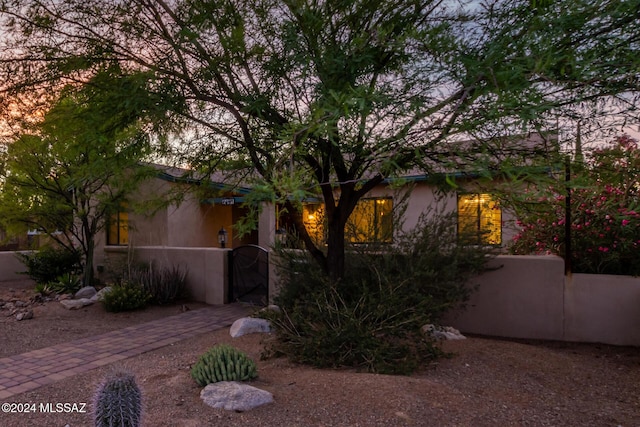 view of property exterior at dusk