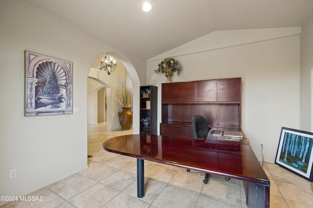 office with light tile patterned floors, an inviting chandelier, and lofted ceiling