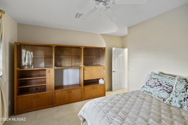 bedroom with light colored carpet and ceiling fan