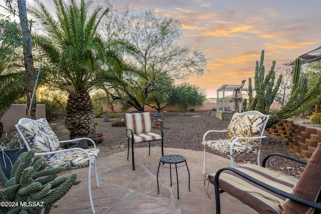 view of patio terrace at dusk