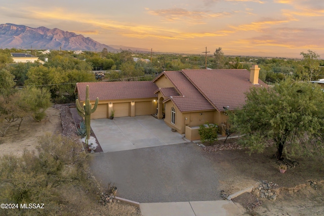 view of front of house featuring a mountain view and a garage