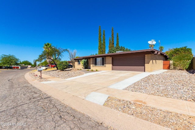 single story home featuring a garage