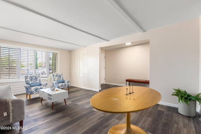 living room with beam ceiling and dark hardwood / wood-style floors