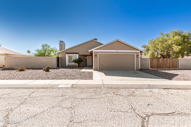 ranch-style house featuring a garage