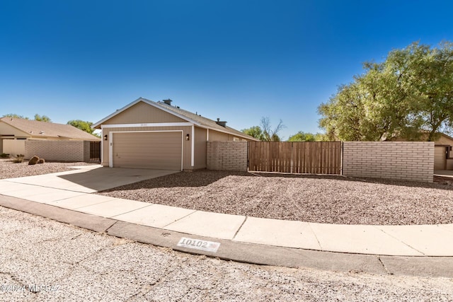 single story home featuring a garage