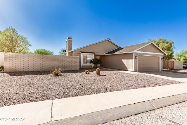 single story home featuring a garage