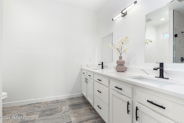 bathroom featuring vanity and walk in shower