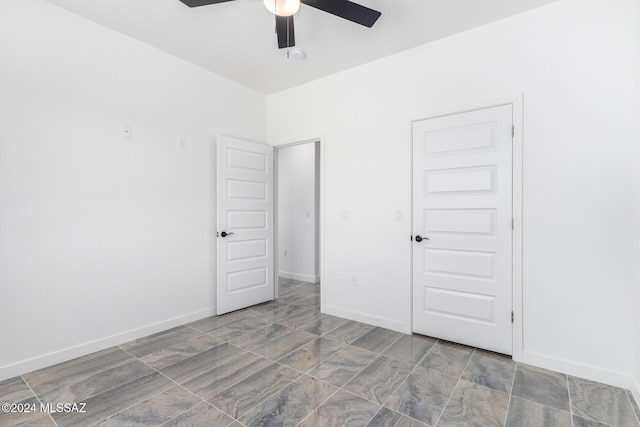 unfurnished bedroom with a closet and ceiling fan