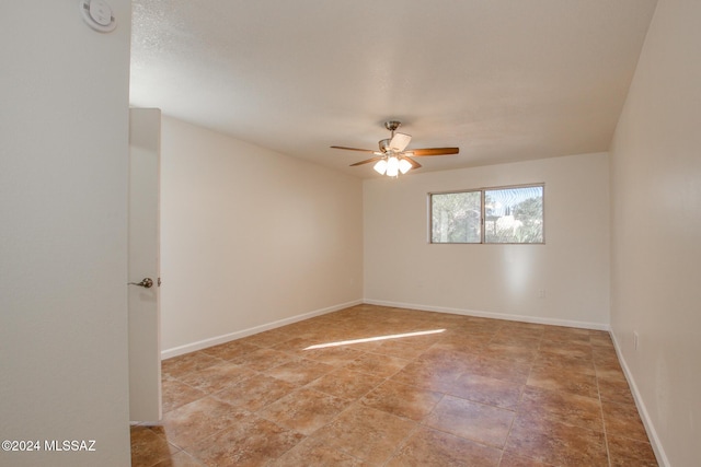 unfurnished room with ceiling fan