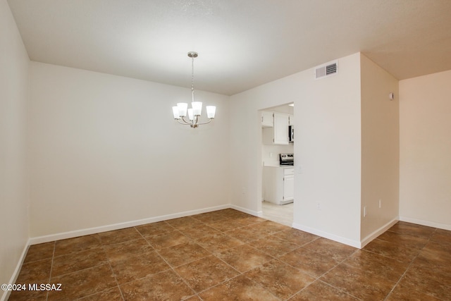 empty room featuring a notable chandelier