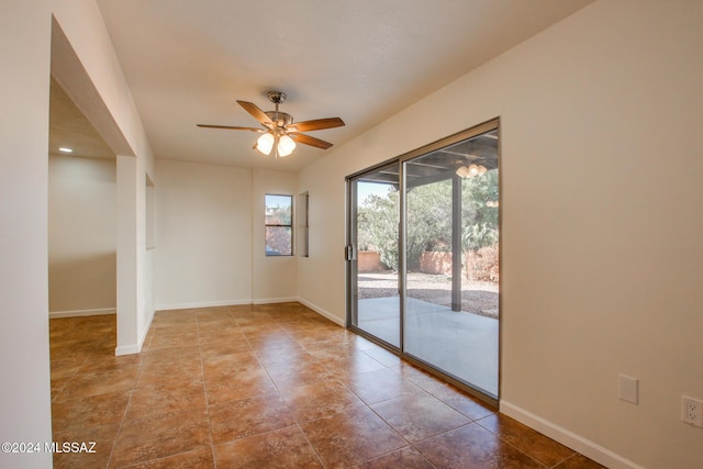 unfurnished room featuring tile patterned floors and ceiling fan