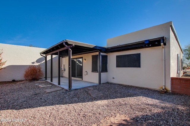 back of house with a patio area