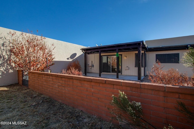 view of property exterior with a patio