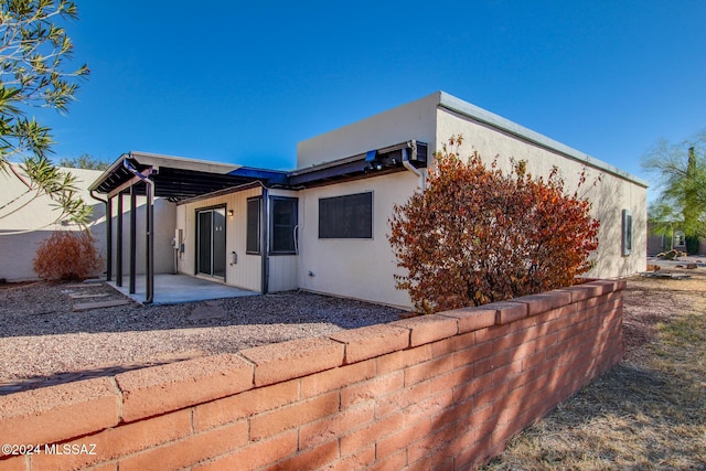 rear view of house with a patio area