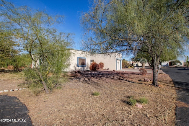 view of side of property with a garage