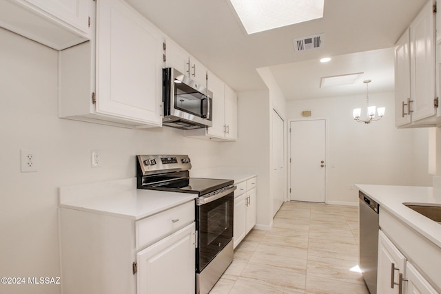 kitchen with white cabinets and stainless steel appliances