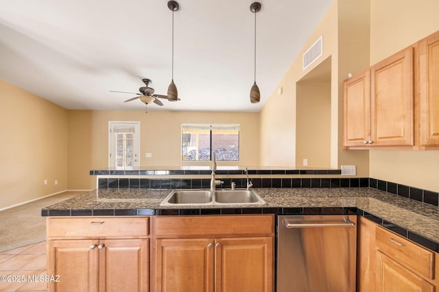 kitchen featuring pendant lighting, dishwasher, sink, light tile patterned flooring, and ceiling fan