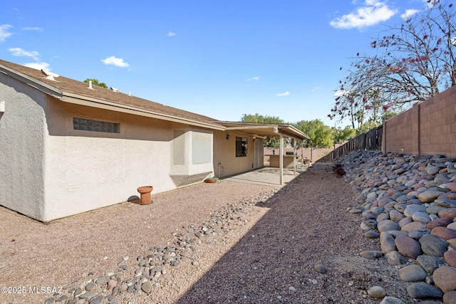 back of house with a patio