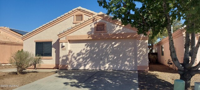 ranch-style home featuring a garage